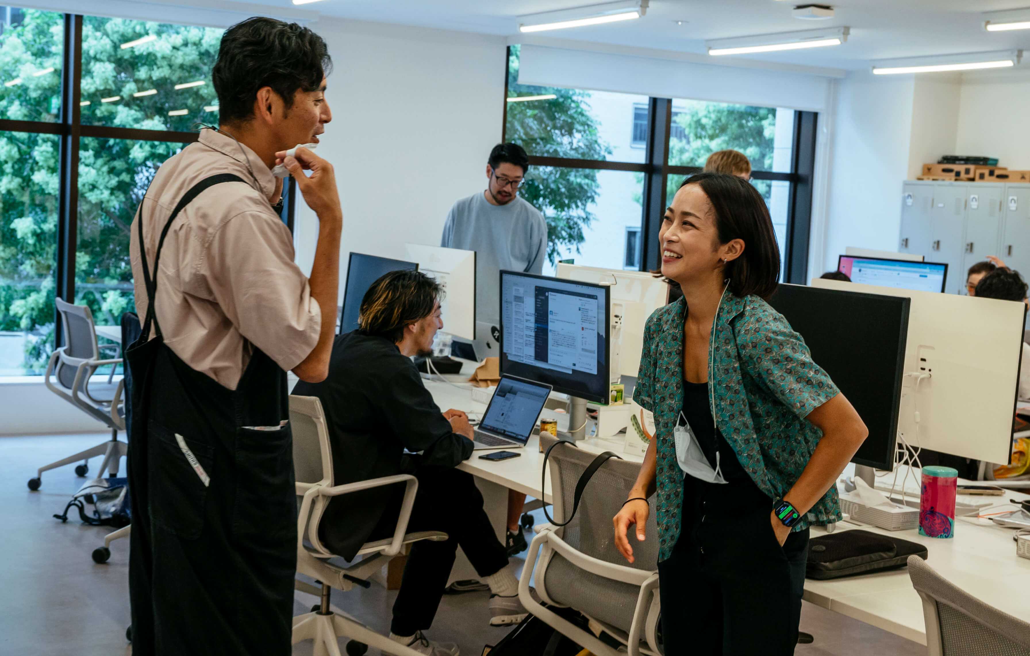 Colleagues talk and work together