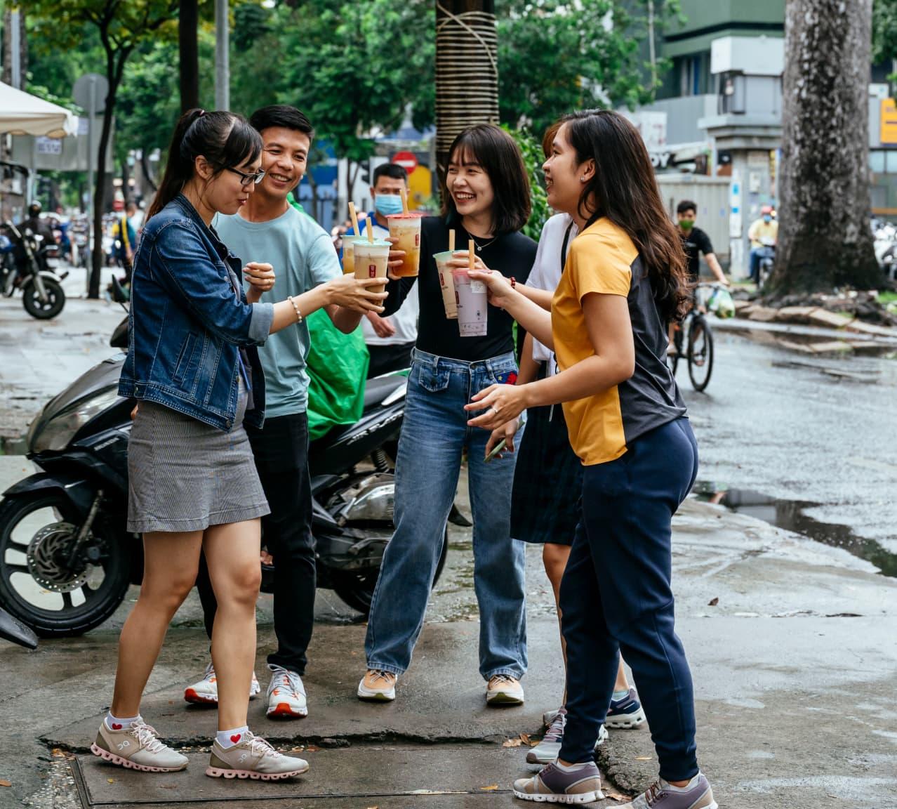 Drinking bubble tea with colleagues outside