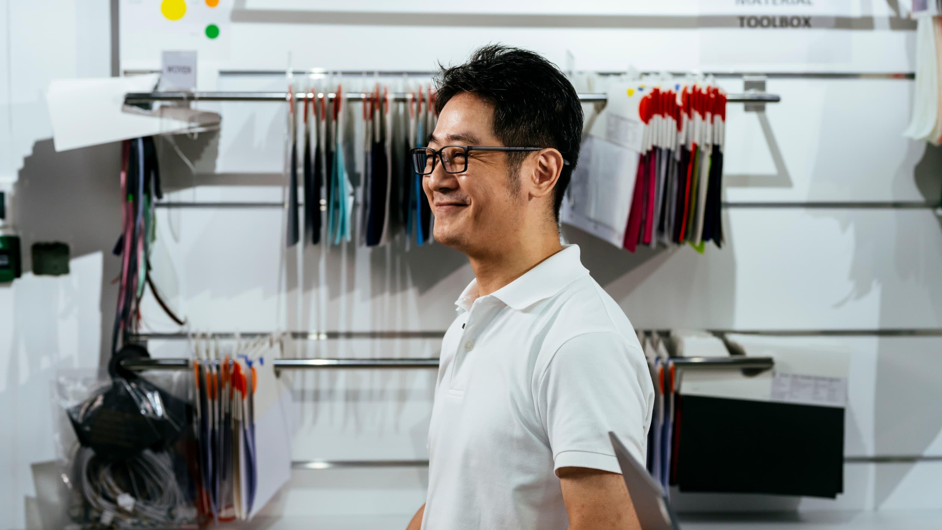 A man smiles in the workshop