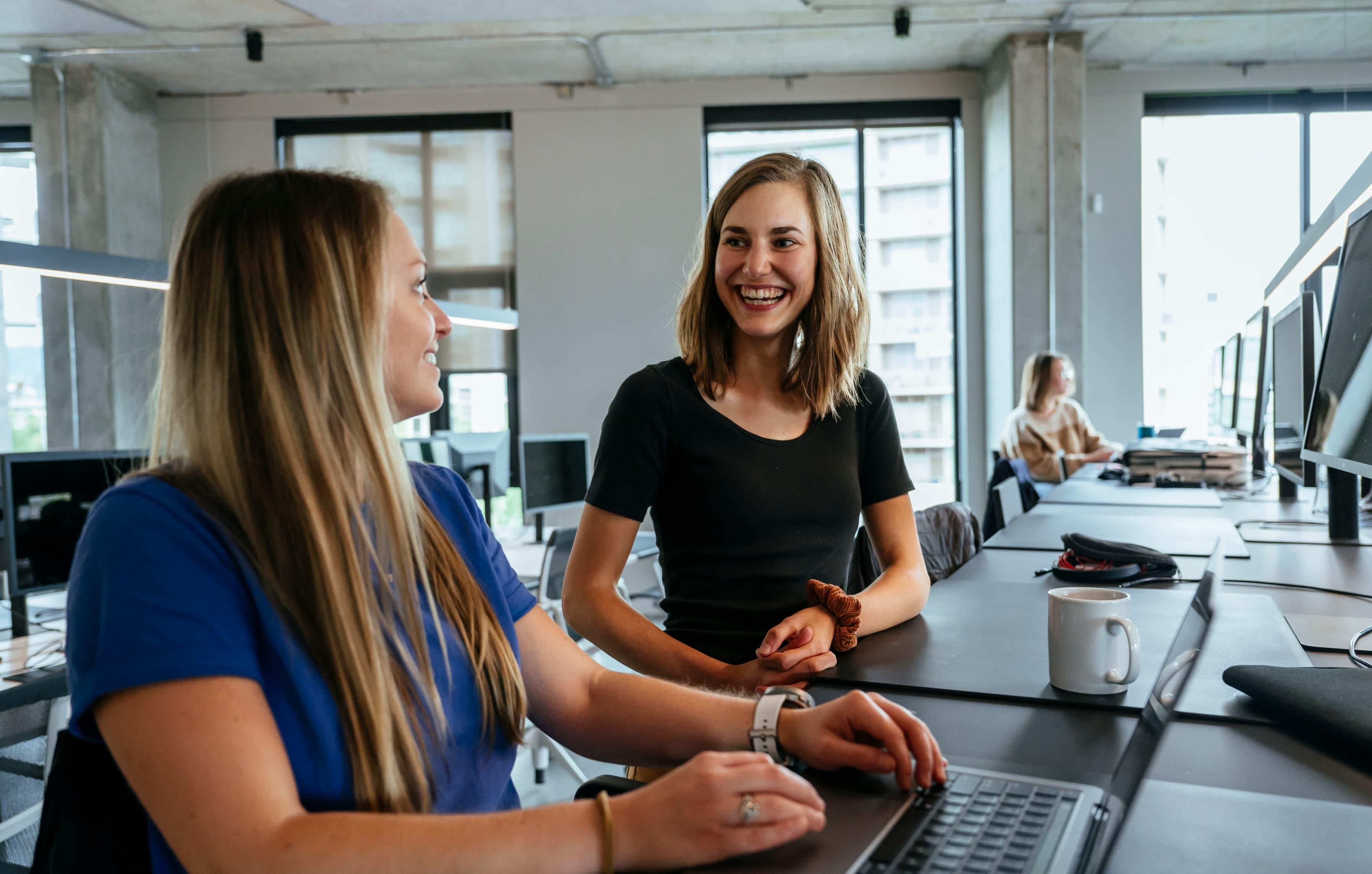 Women talking in the office kitchen