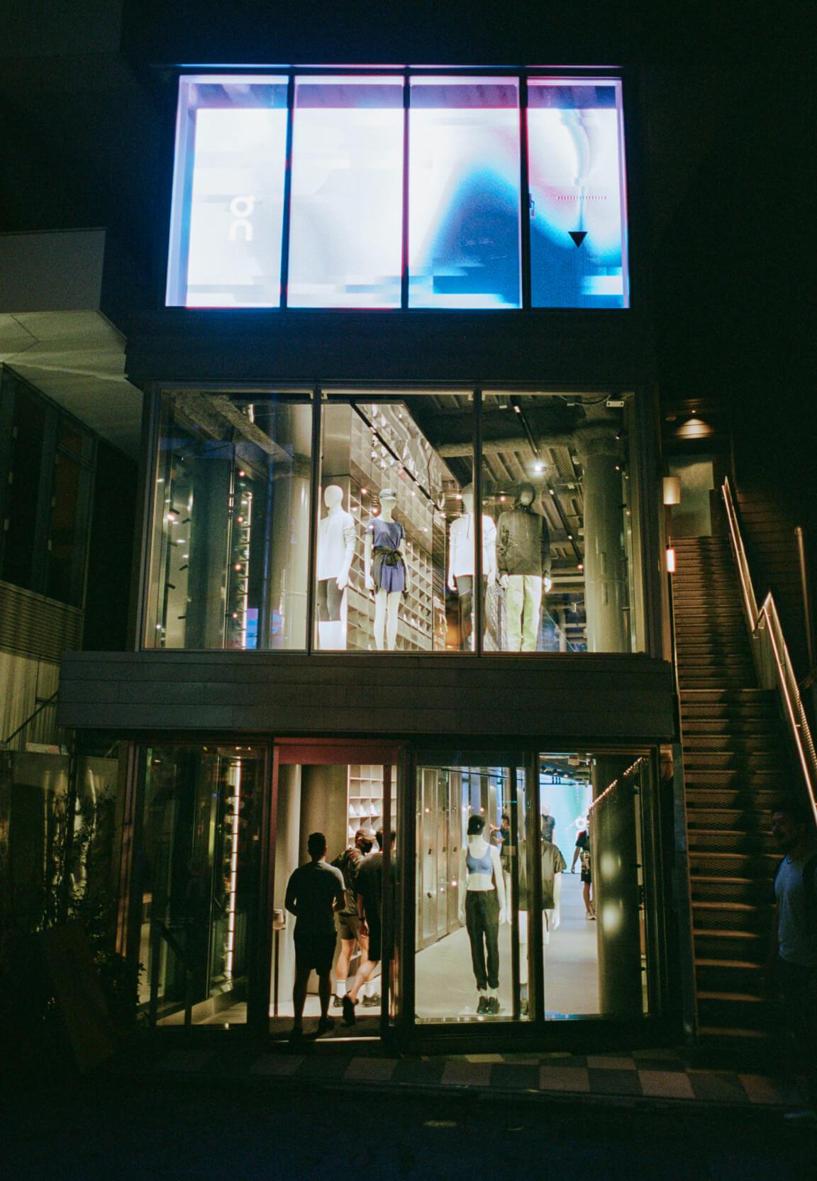 tokyo on running store in the dark at night time