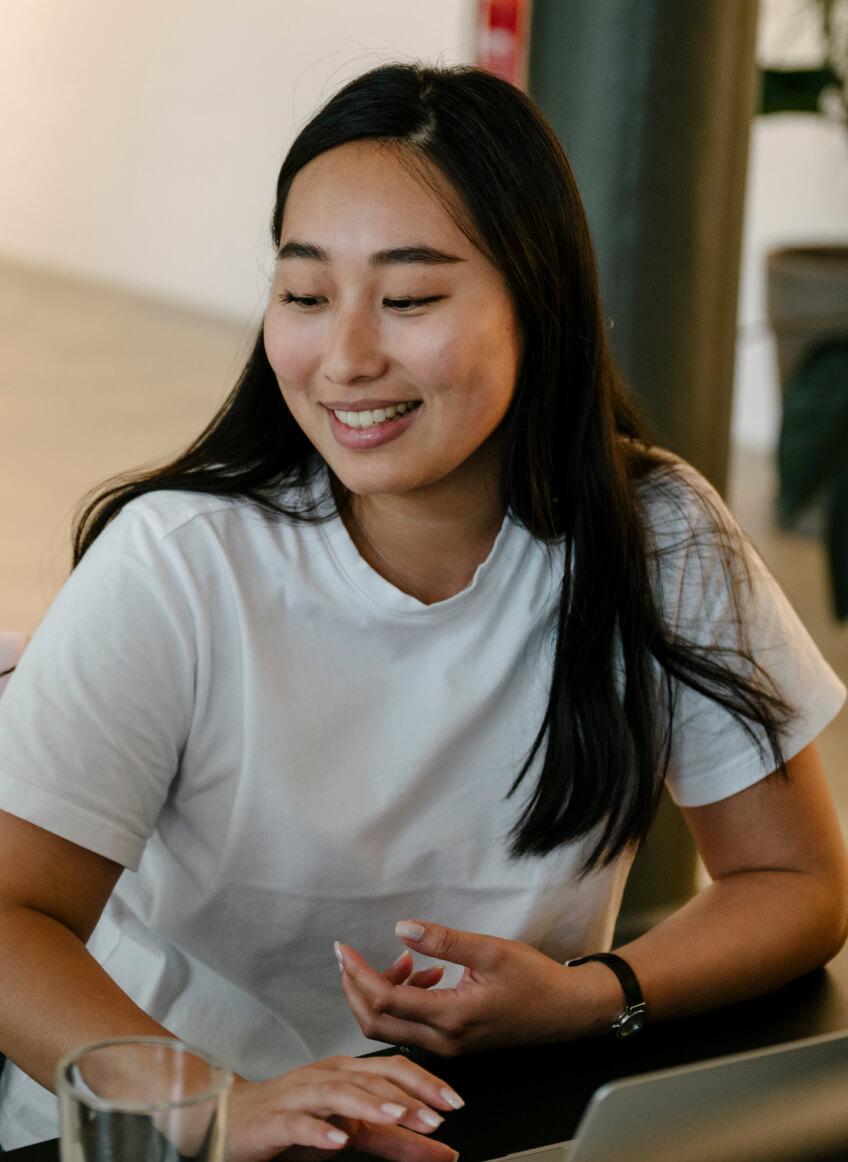 woman in white top smiling