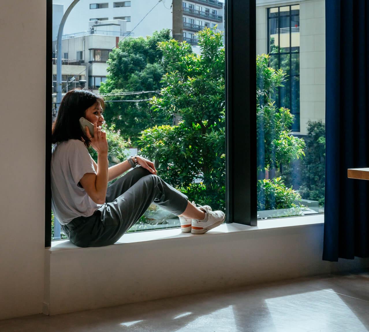 Girl sitting near window