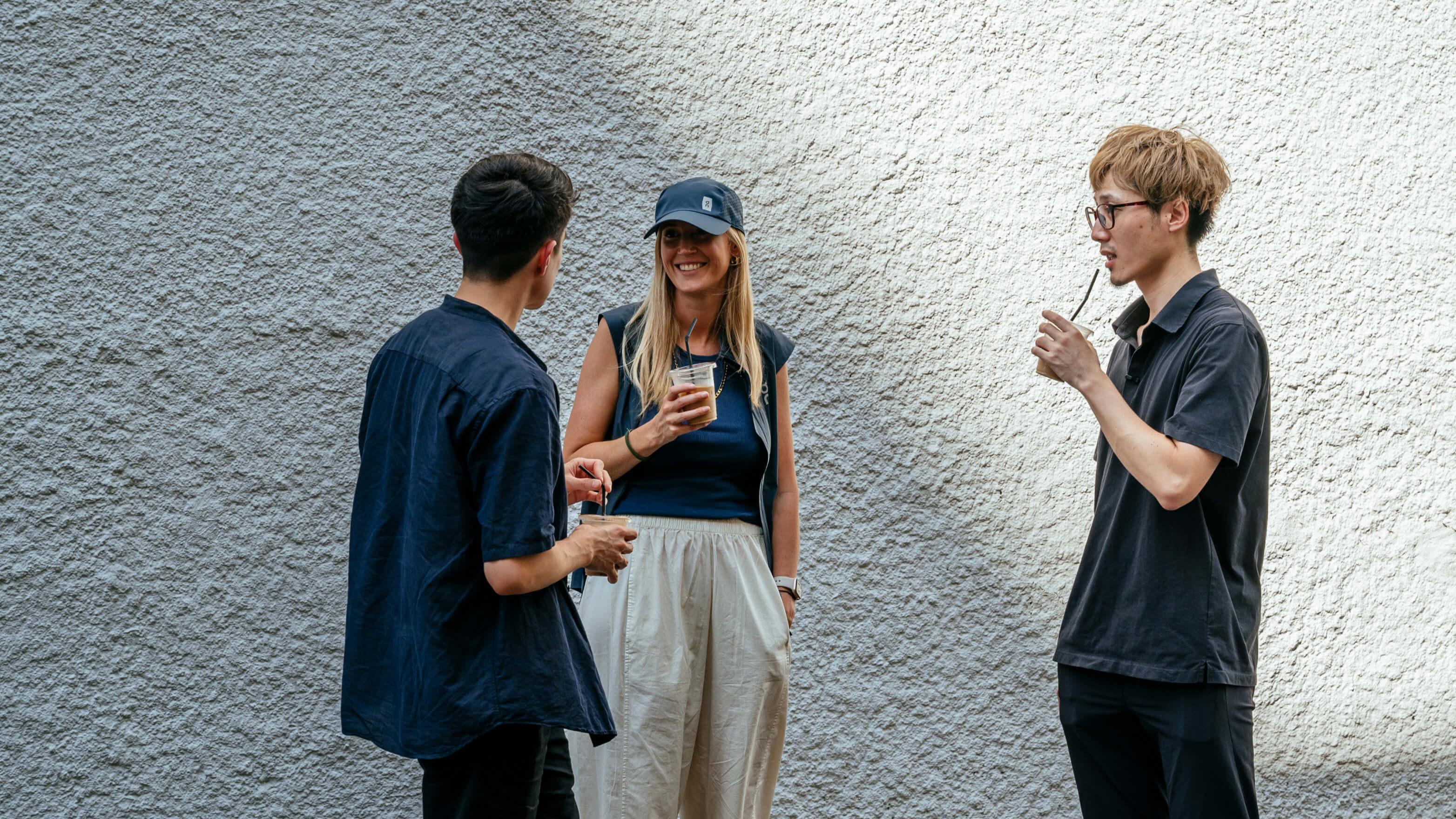 Coworkers drinks beverages near the office building