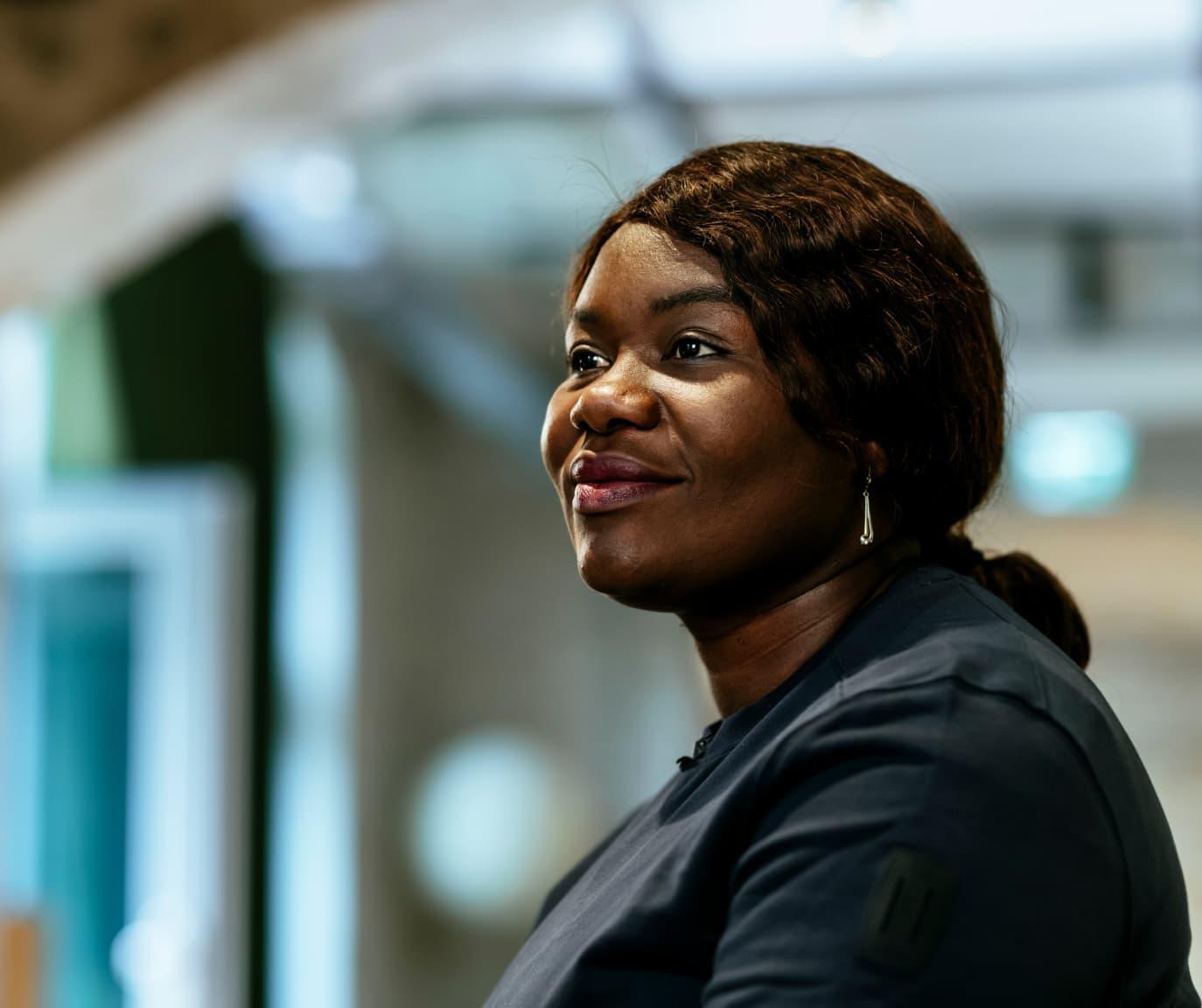 A portrait of a woman looking to the left of the camera.