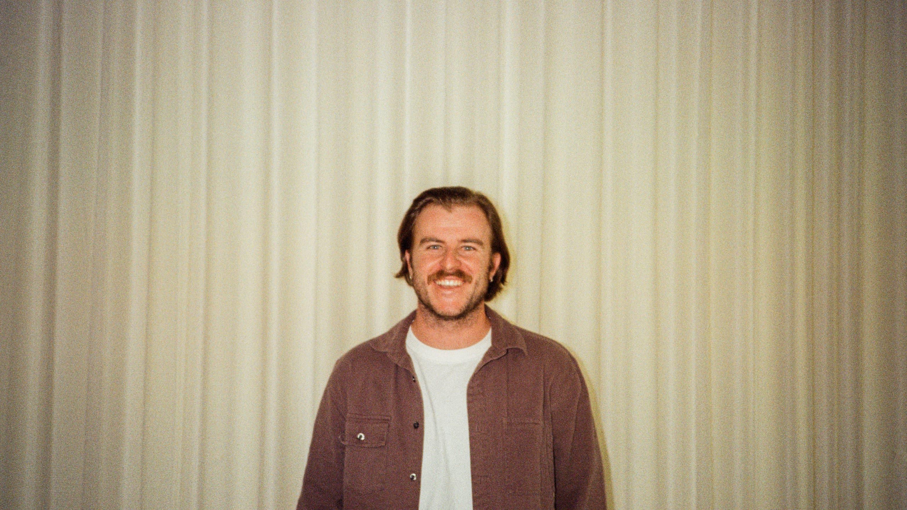 A man smiling in the office of On