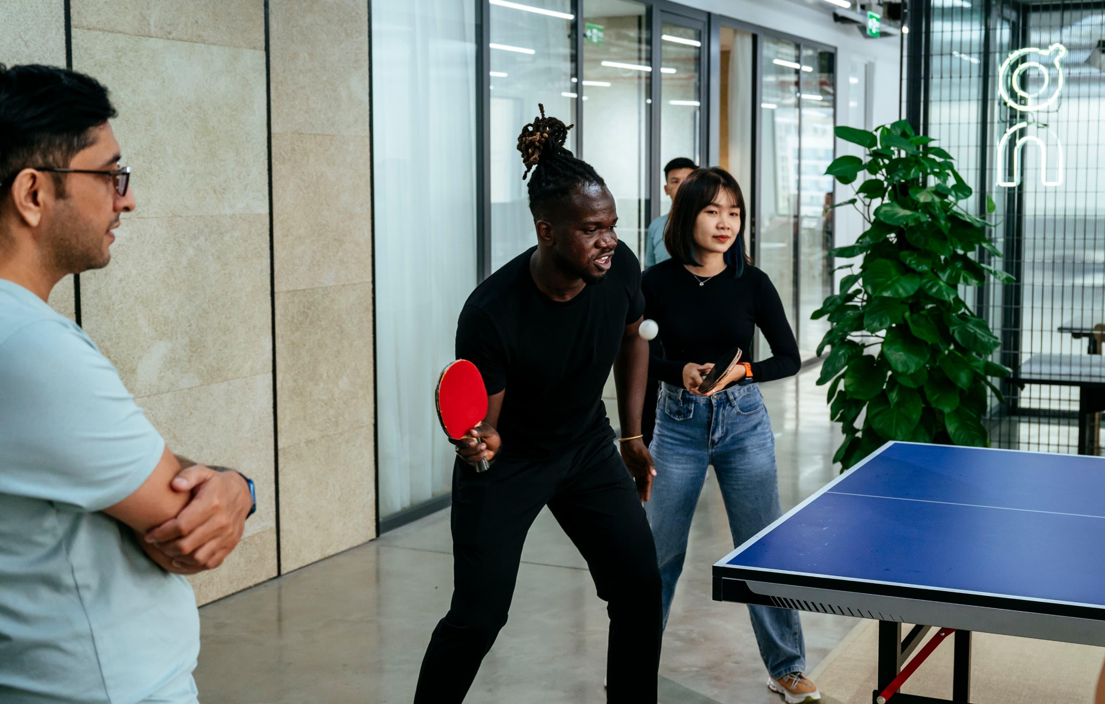 A group of people plays tennis