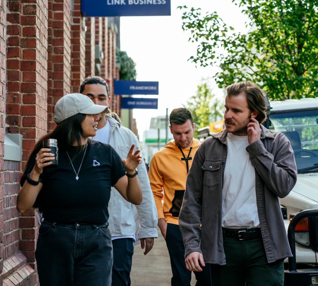 A group of colleagues walks and talks