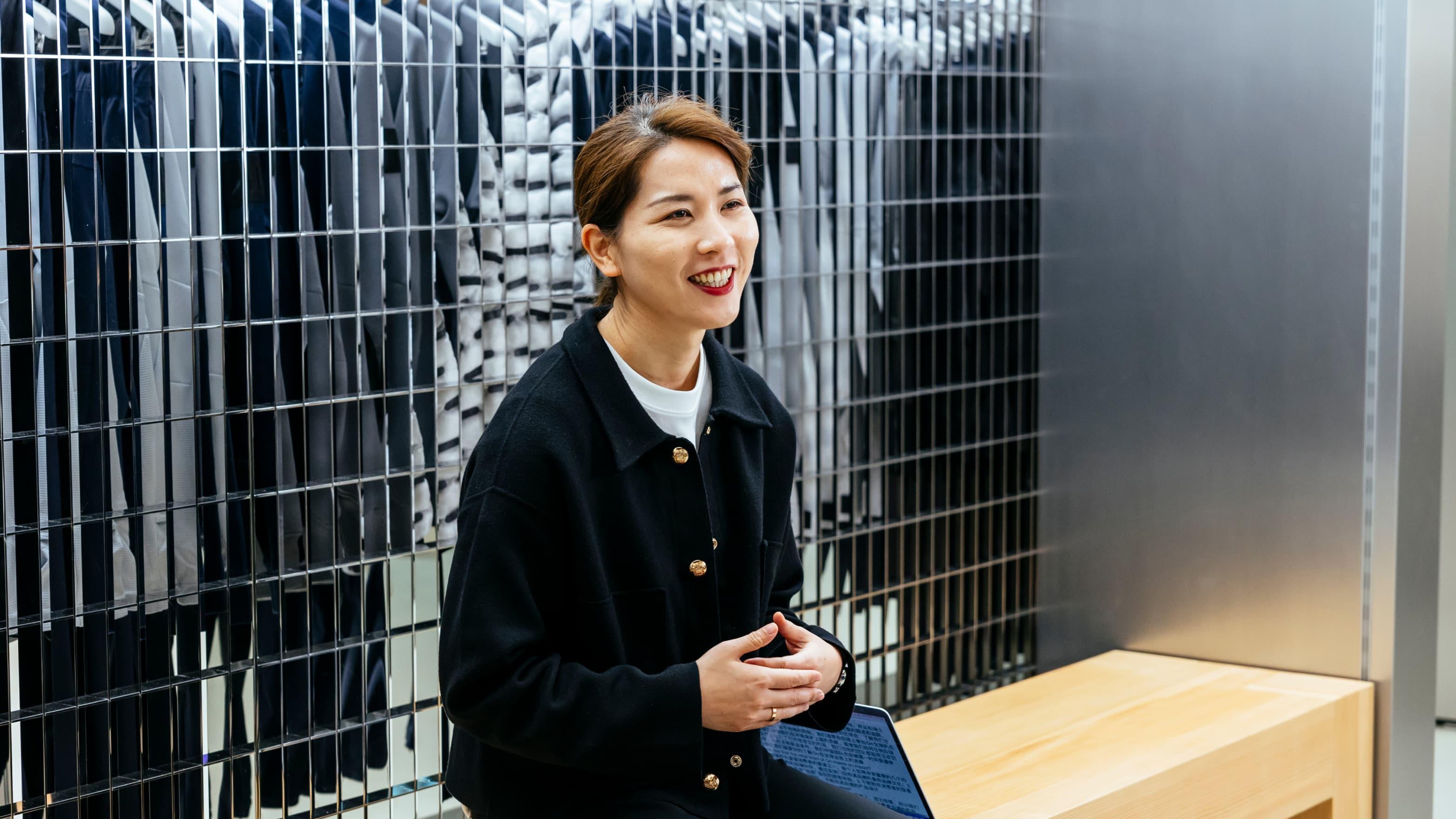 Woman smiles and looks away in the showroom