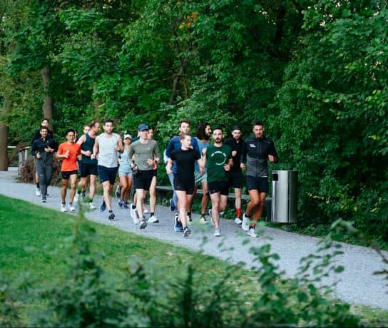 The group of runners in the forest