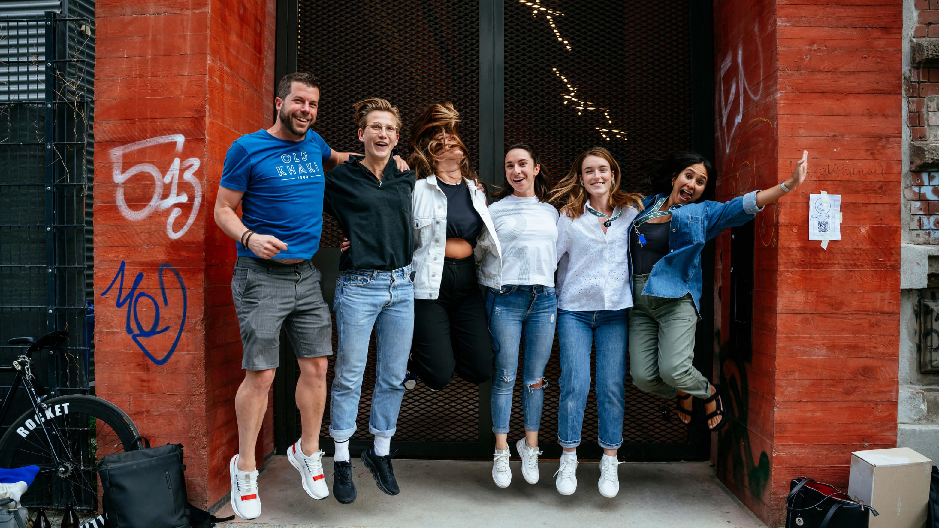 Group of people jumping together