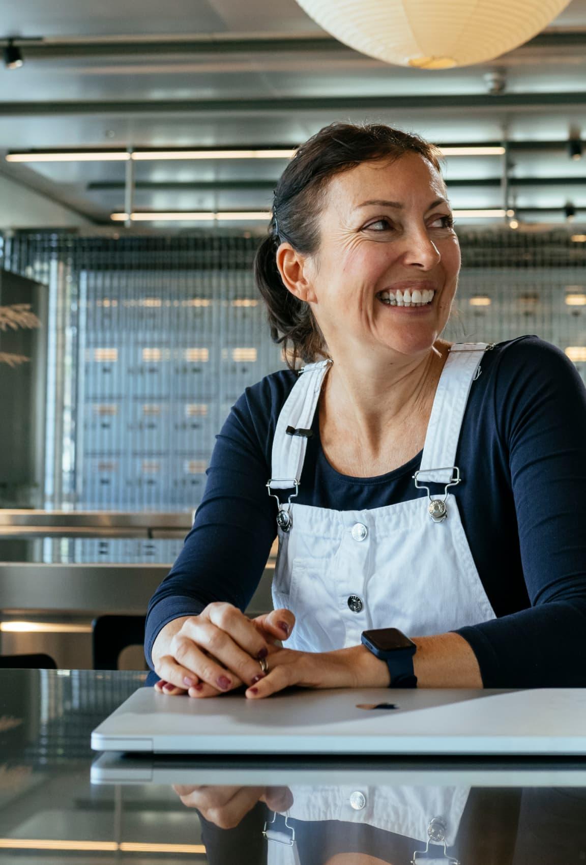 A woman smiling while working