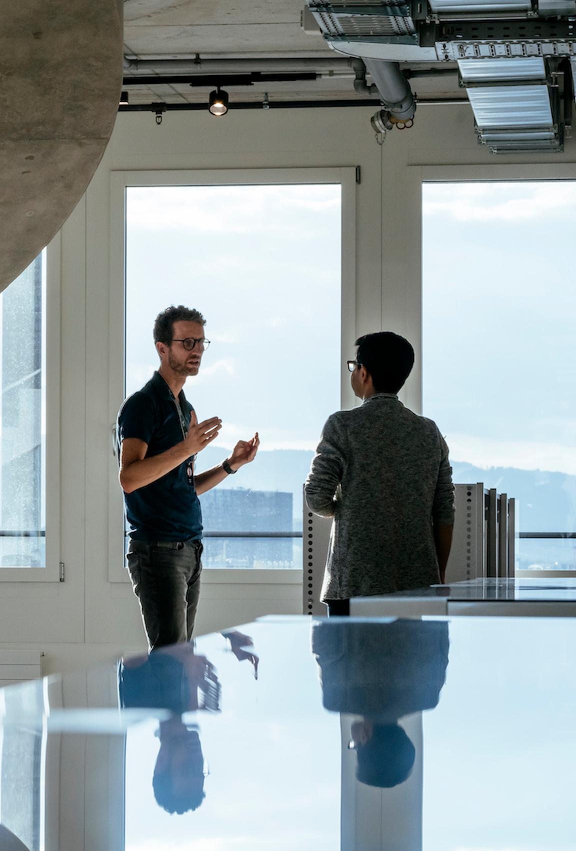 Two men interacting in On's Zurich office