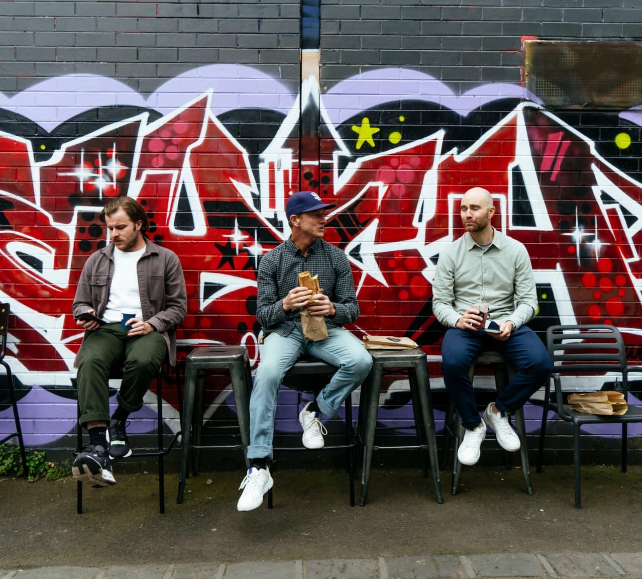 On coworkers enjoying panini in Melbourne