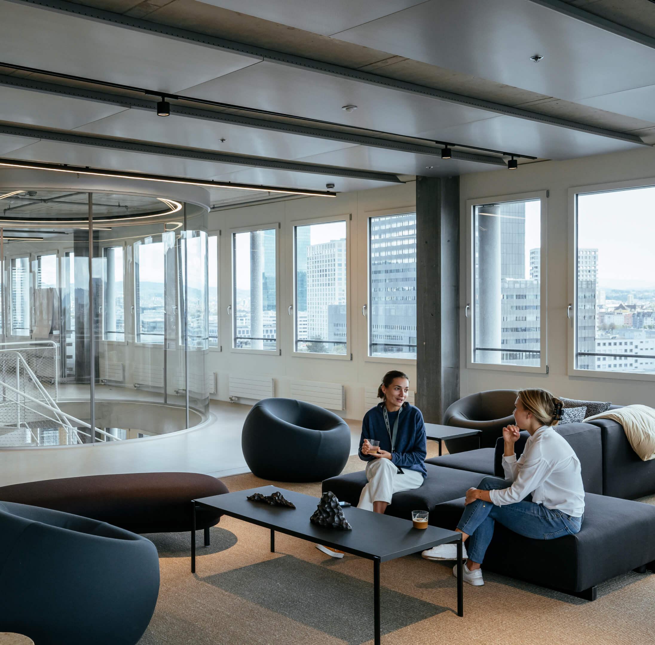 Two woman sat in a lobby area
