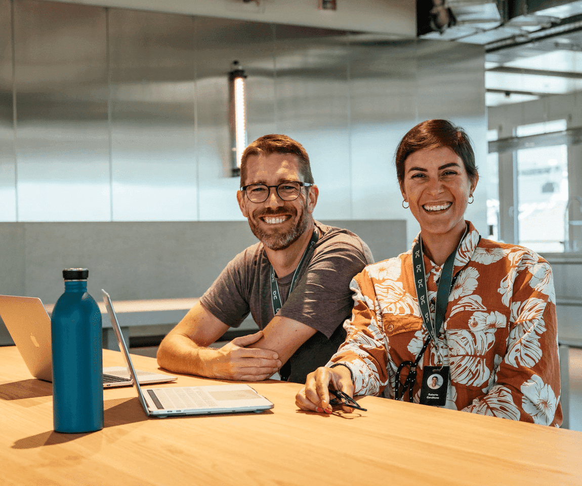 Happy man and woman with laptop