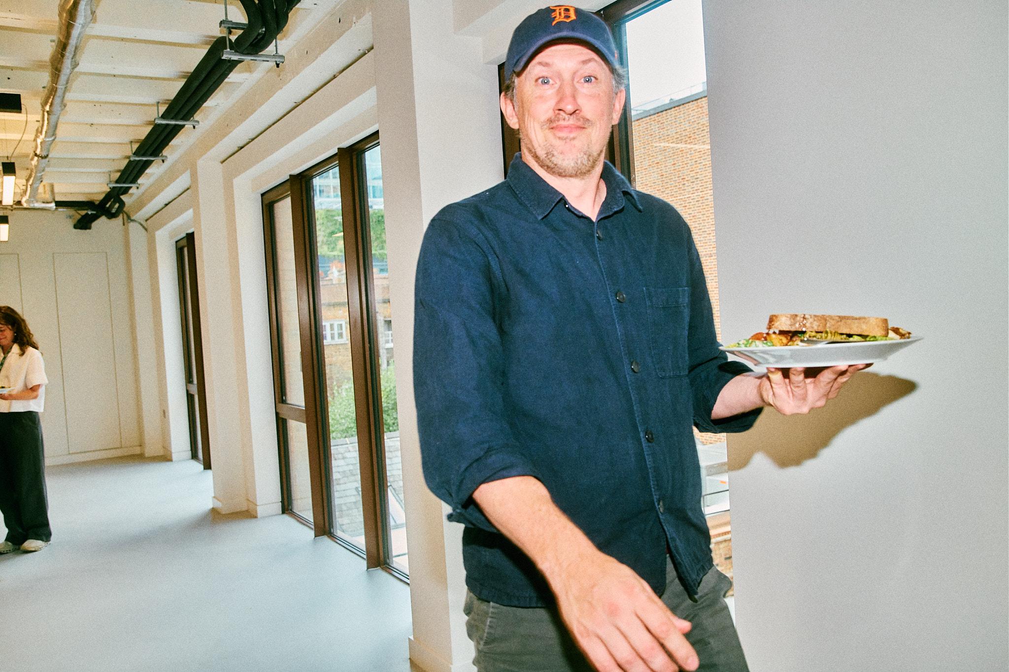 A person carrying a sandwich