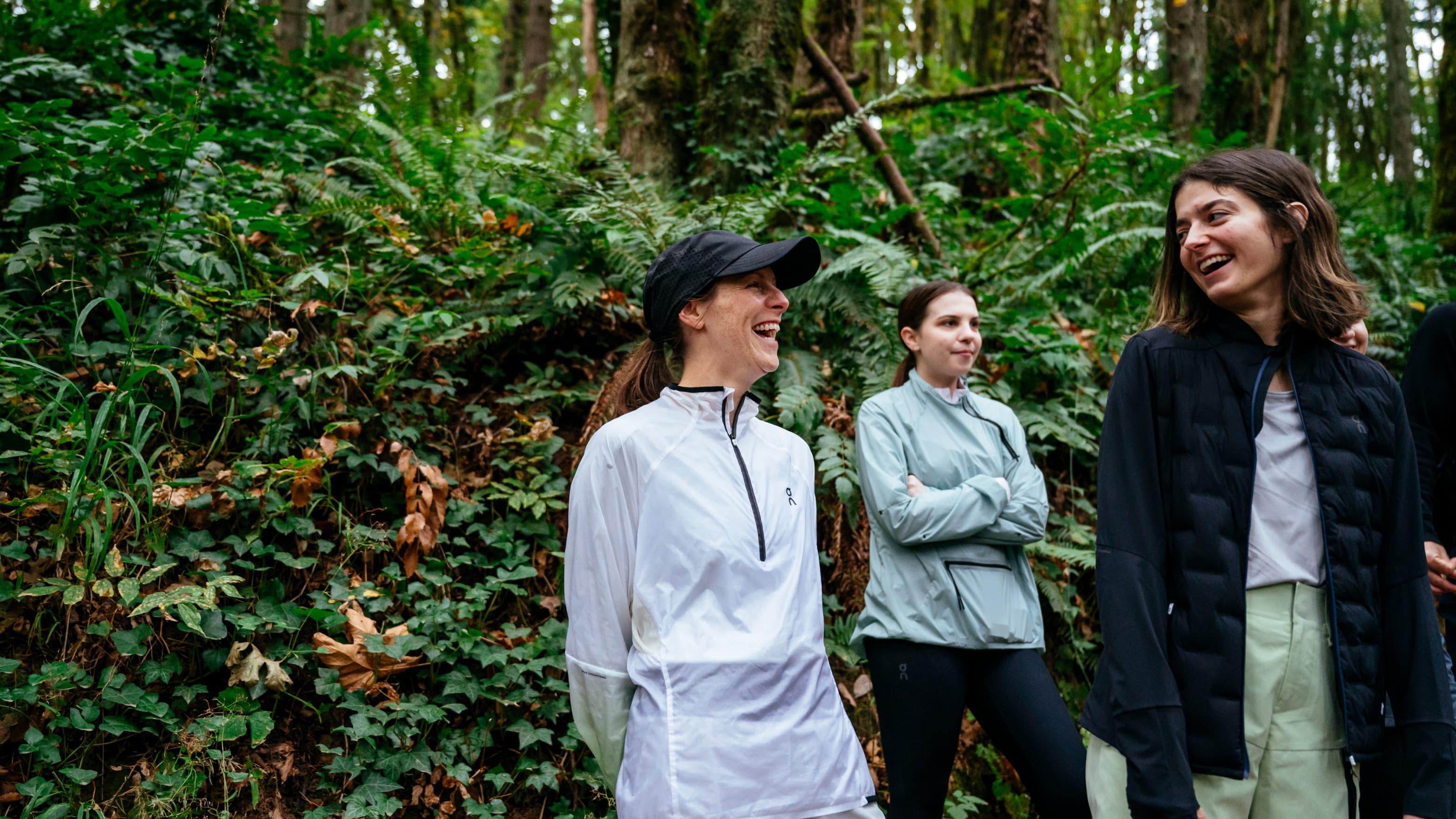 People laugh in the forest after running session