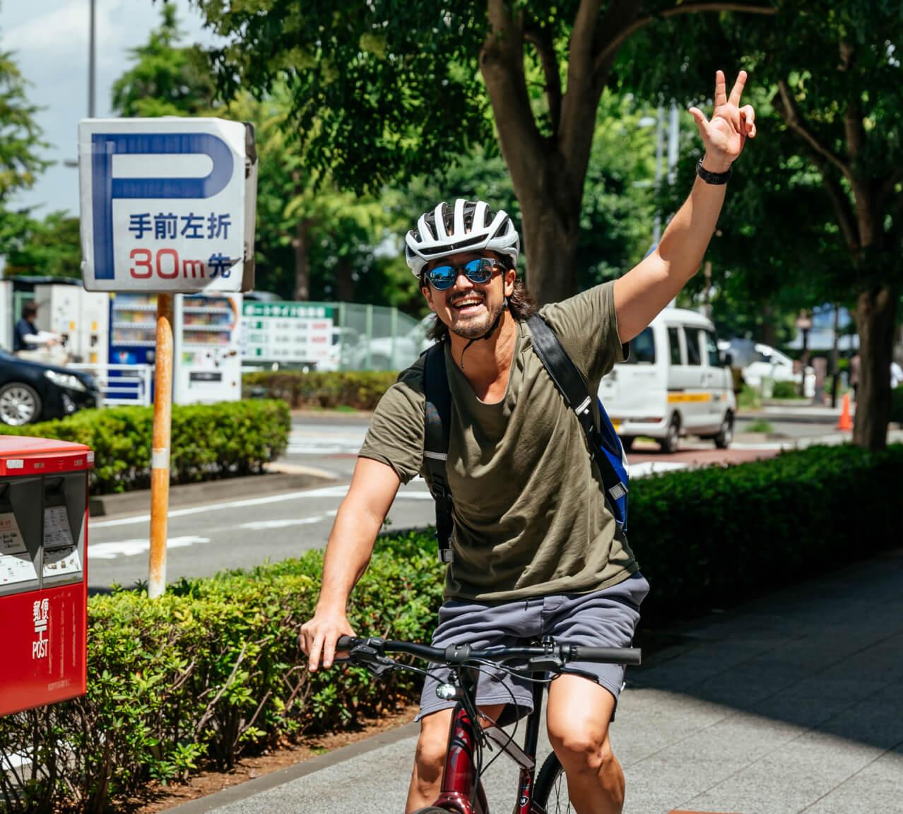 Happy cyclist smiles