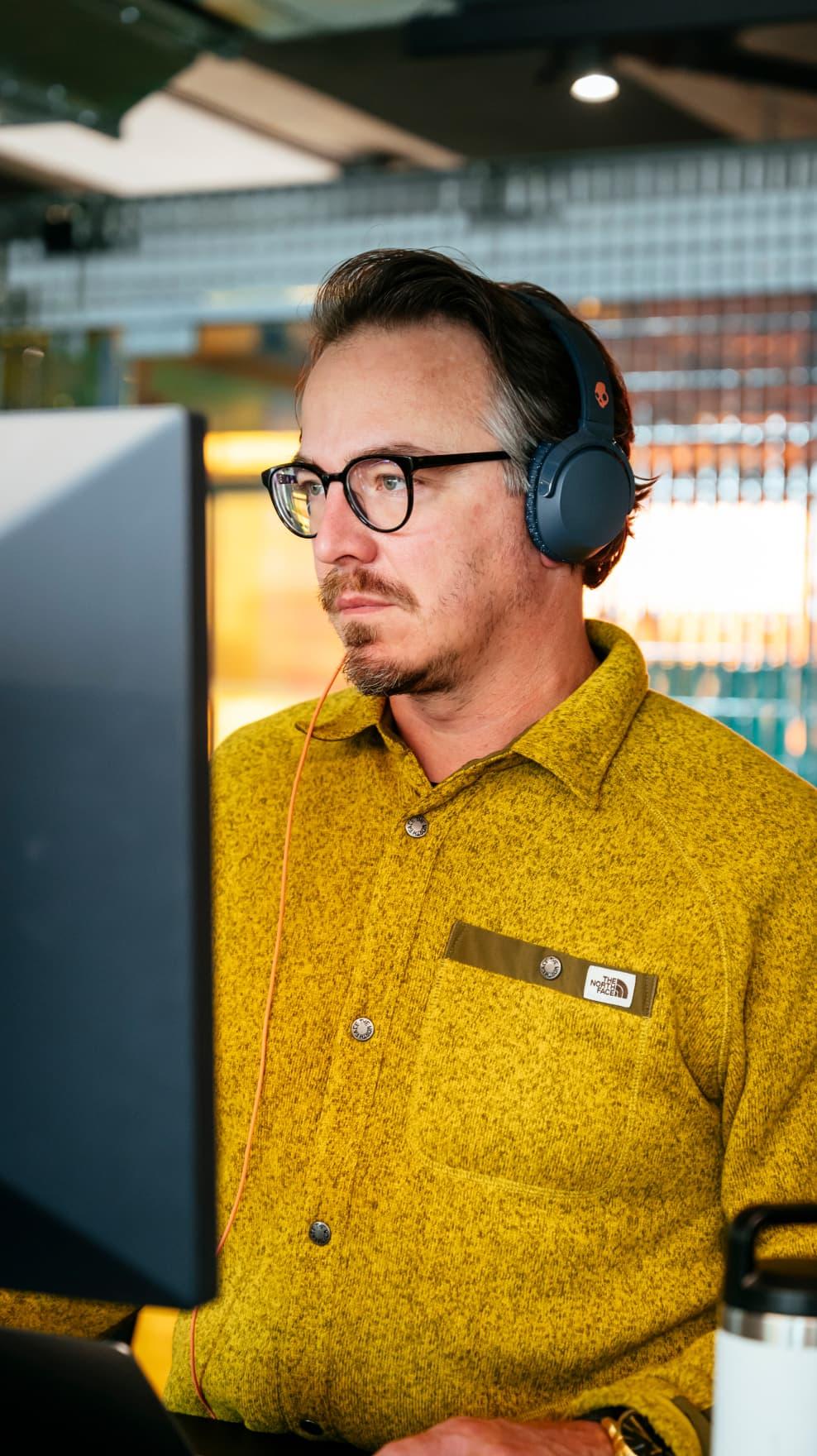 Man works in the office in headphones